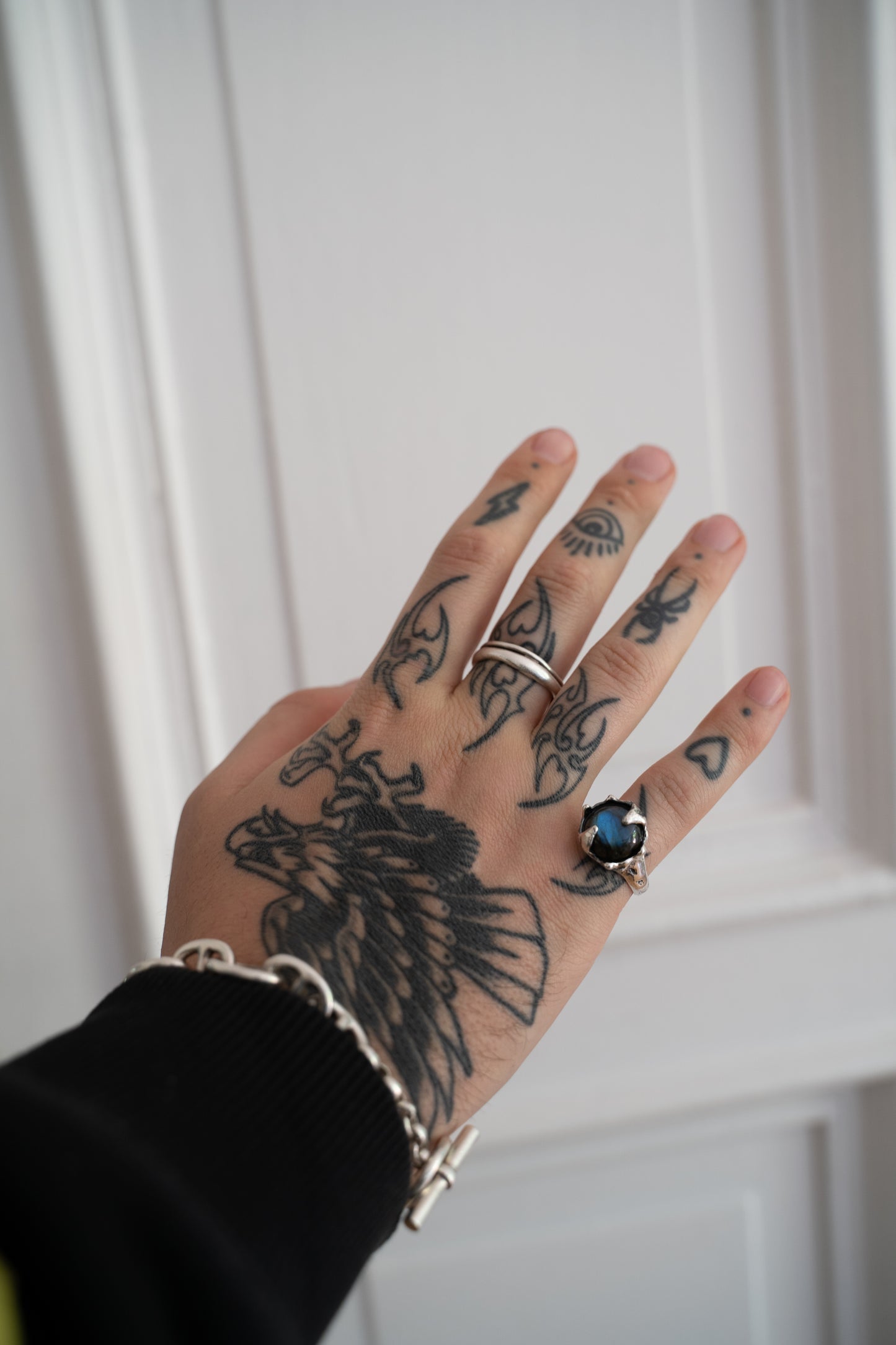 Tattooed hand wearing a Silver Labradorite Ring 